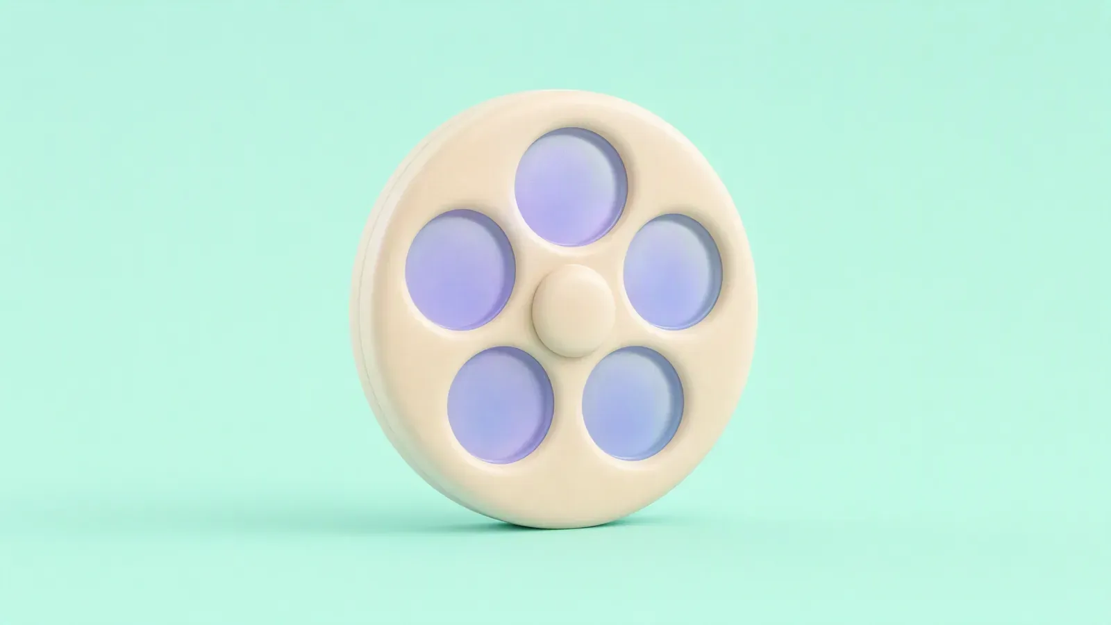 Cream clay film reel with frosted lavender openings on a mint background